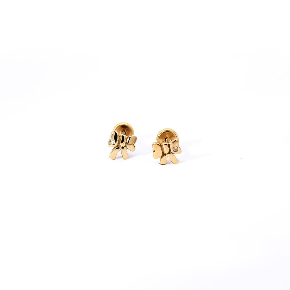 Aretes para bebe en oro amarillo  18kt y  diamantes con diseño de lazos