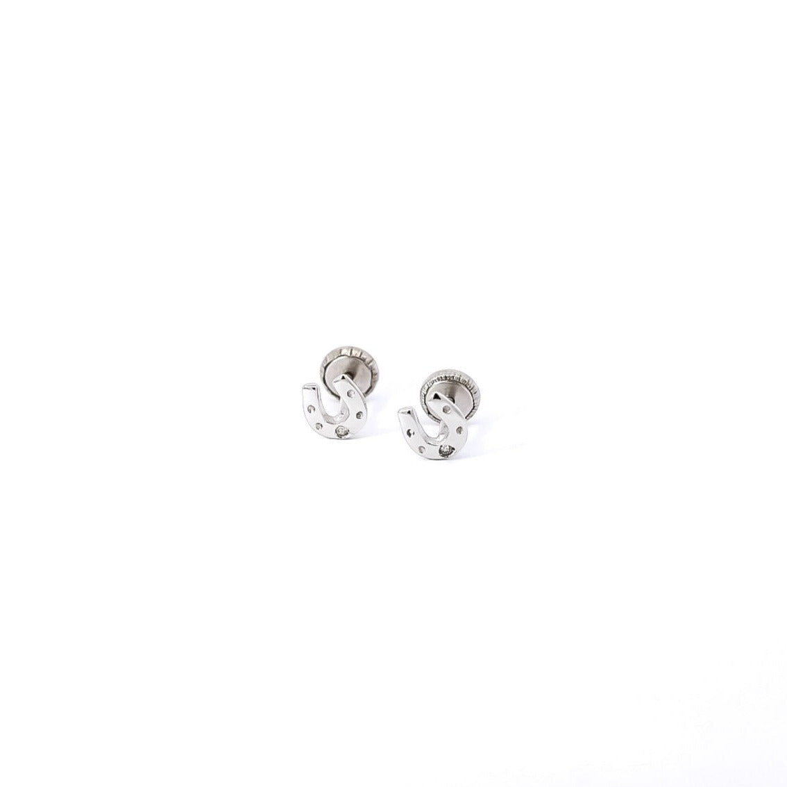 Aretes para bebe en oro blanco 18kt  y diamantes con diseño de herradura