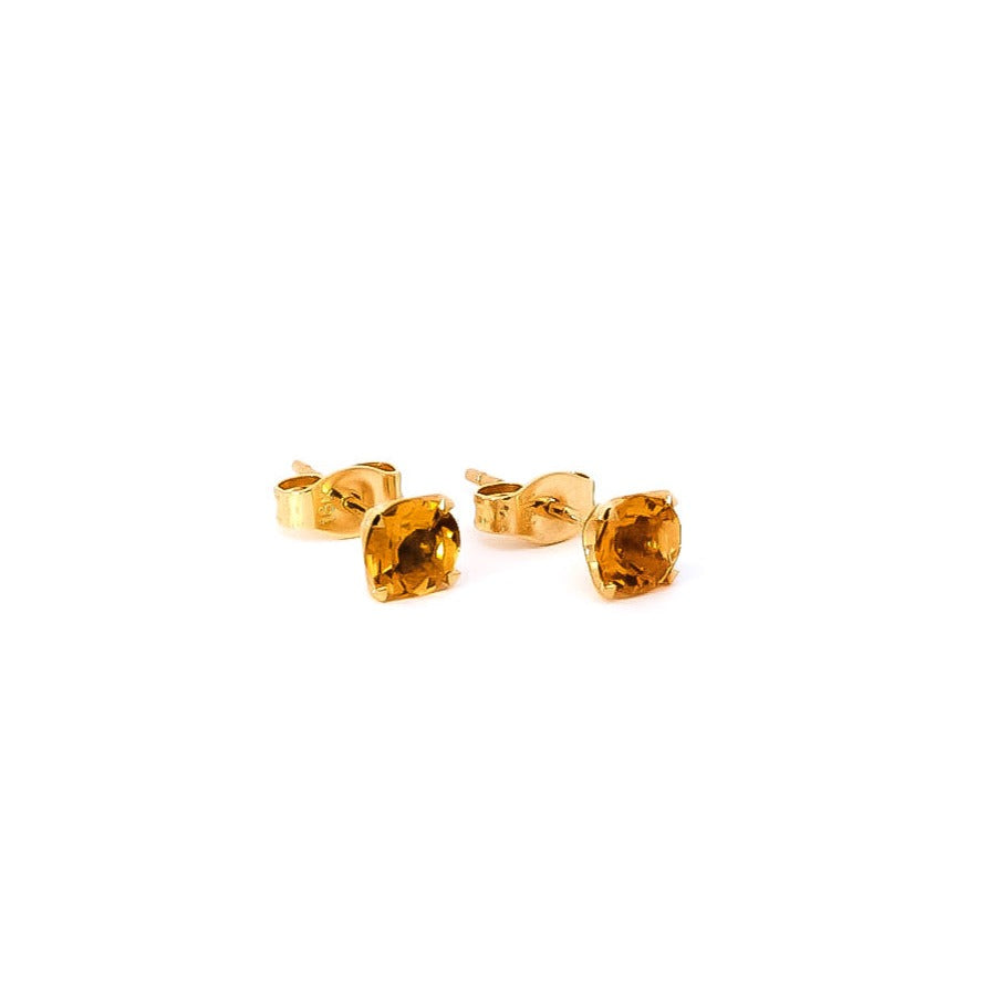 Aretes tipo topo en oro amarillo con citrino 0.84ct corte redondo