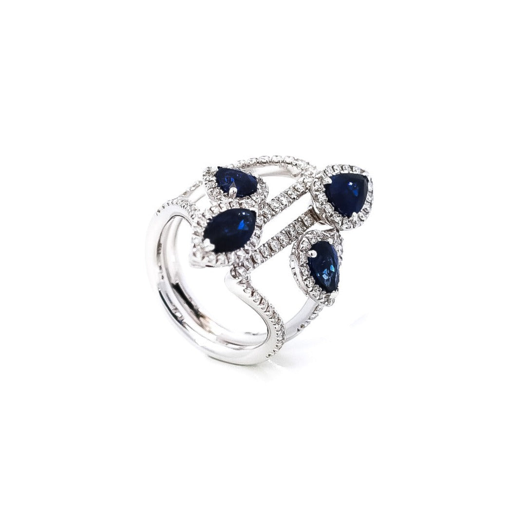 Anillo oro blanco diseño de líneas entrelazadas con zafiros corte pera