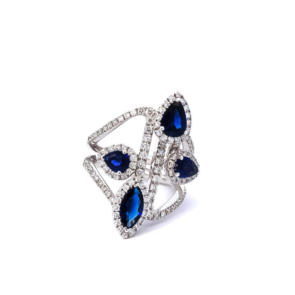 Anillo oro blanco diseño de líneas entrelazadas con zafiros corte pera
