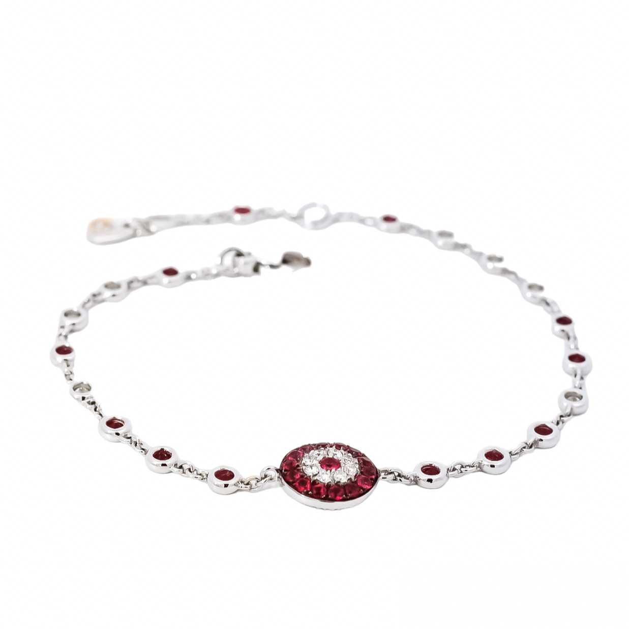 Pulsera lineal en oro blanco  con diamantes y rubís diseño de ojo tuco