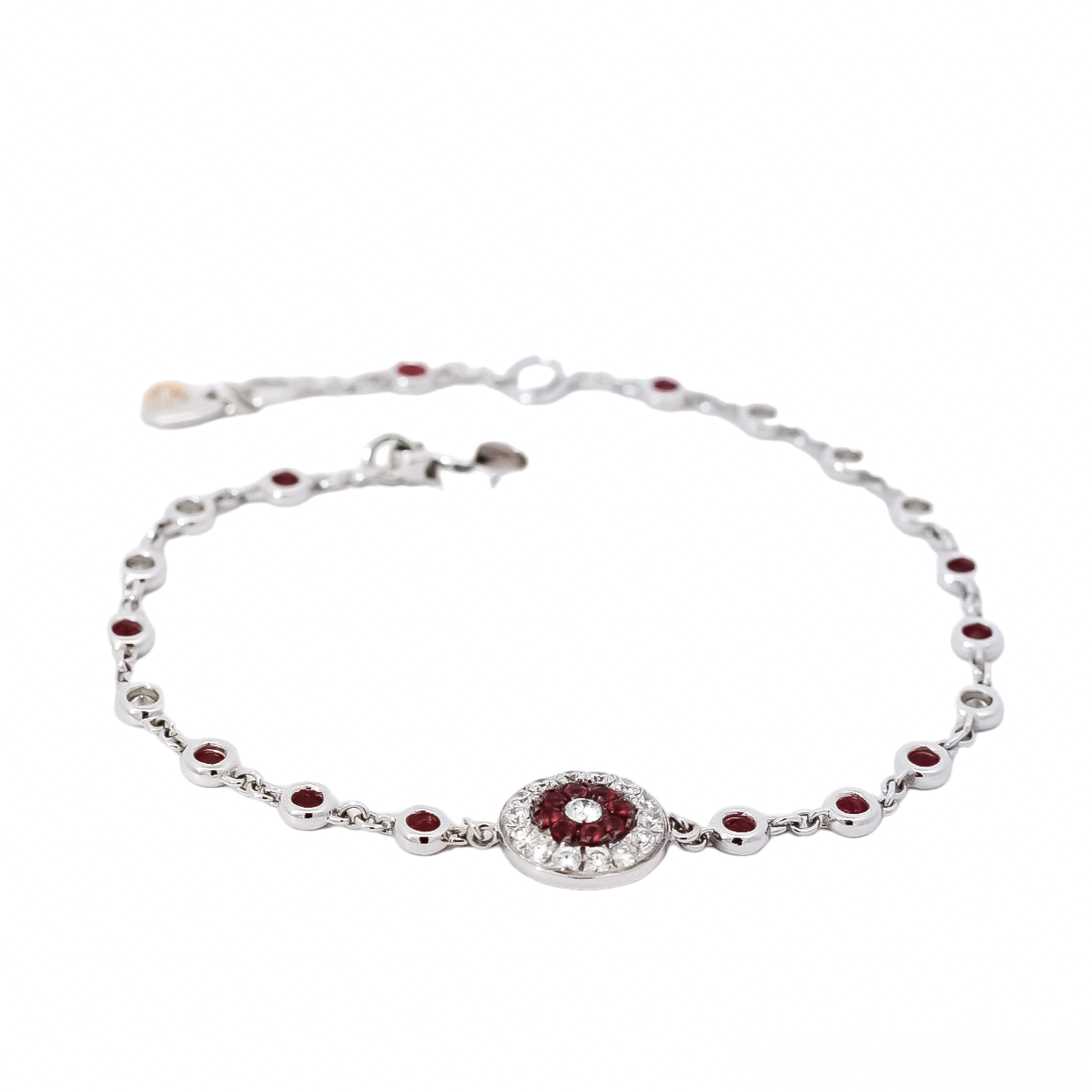 Pulsera lineal en oro blanco  con diamantes y rubís diseño de ojo tuco