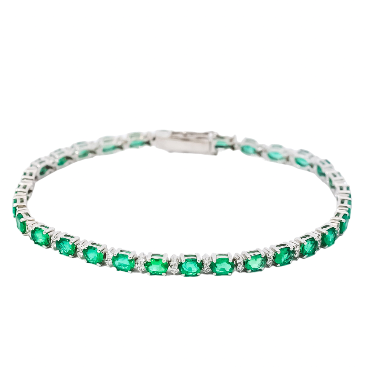 Pulsera oro blanco 18kt tipo tenis con diamantes y esmeraldas