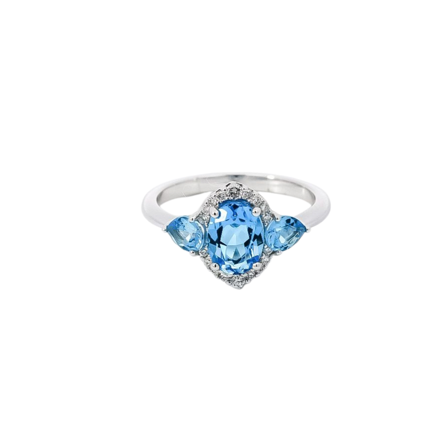 Anillo oro blanco con halo en diamantes y topacios 1.03 en corte ovalando , pera
