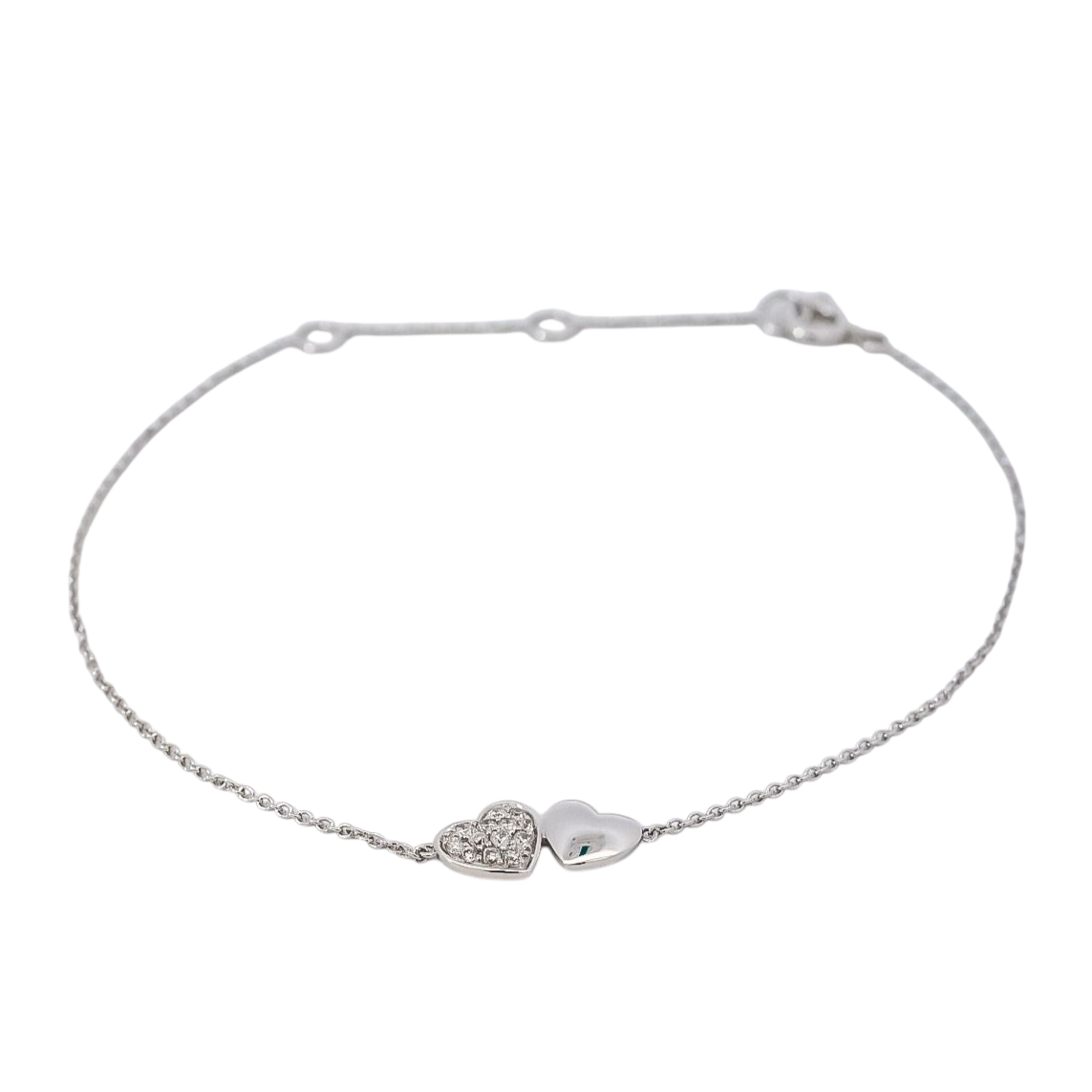 Pulsera delgada oro blanco con dije de doble corazones en diamantes