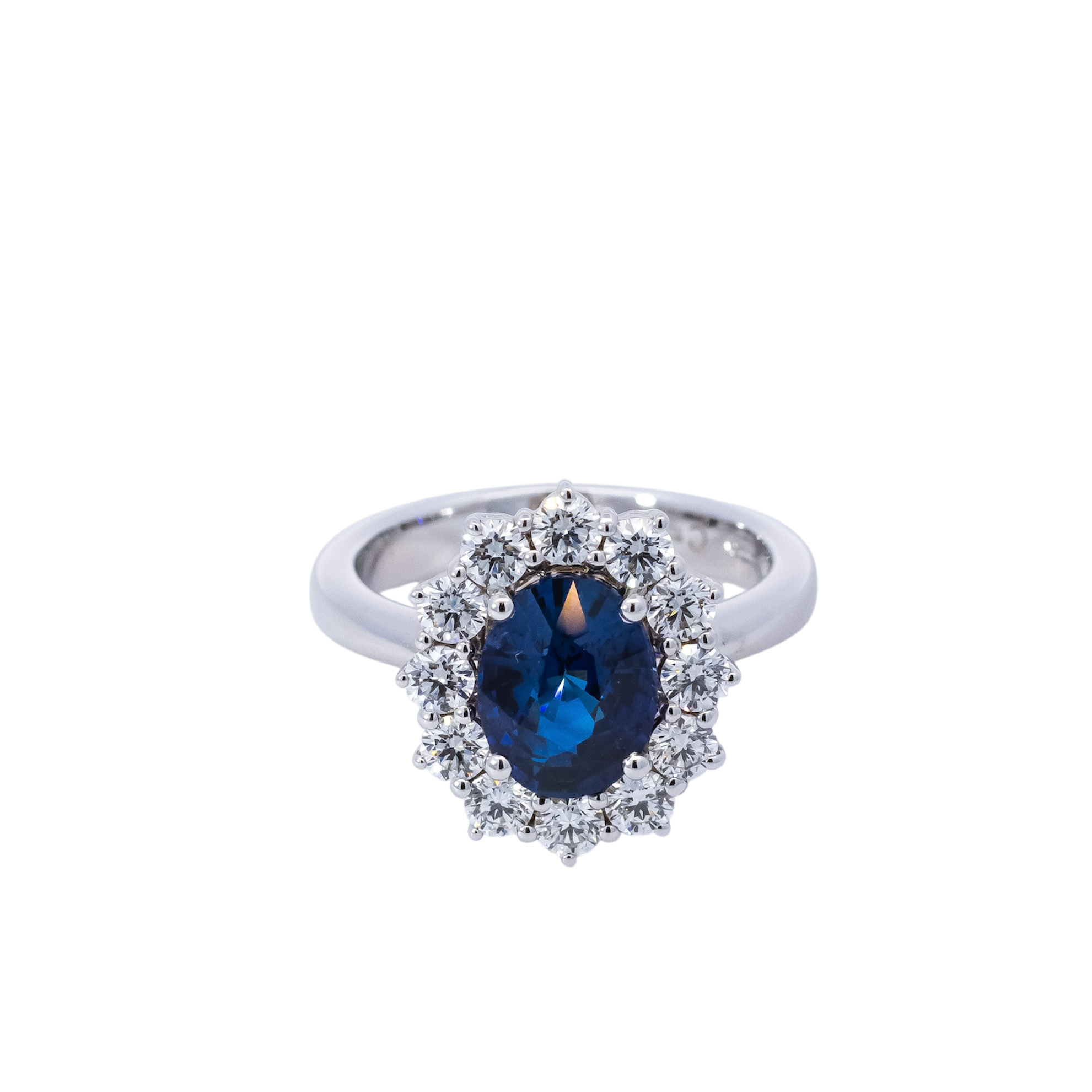 Anillo oro blanco 18kt con halo de diamantes y zafiro ovalado