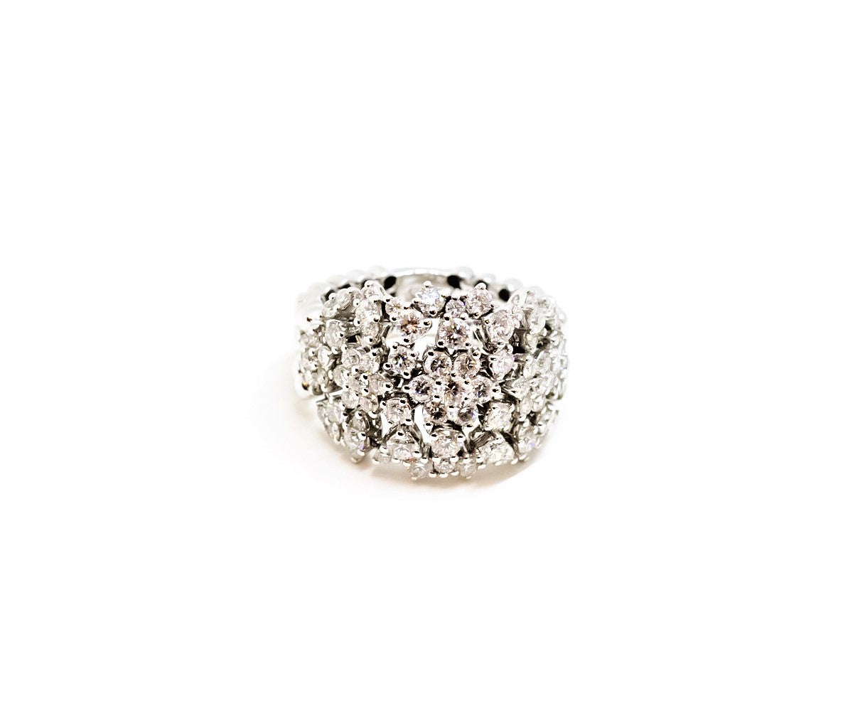 Anillo oro blanco elástico con diamantes diseño de flores