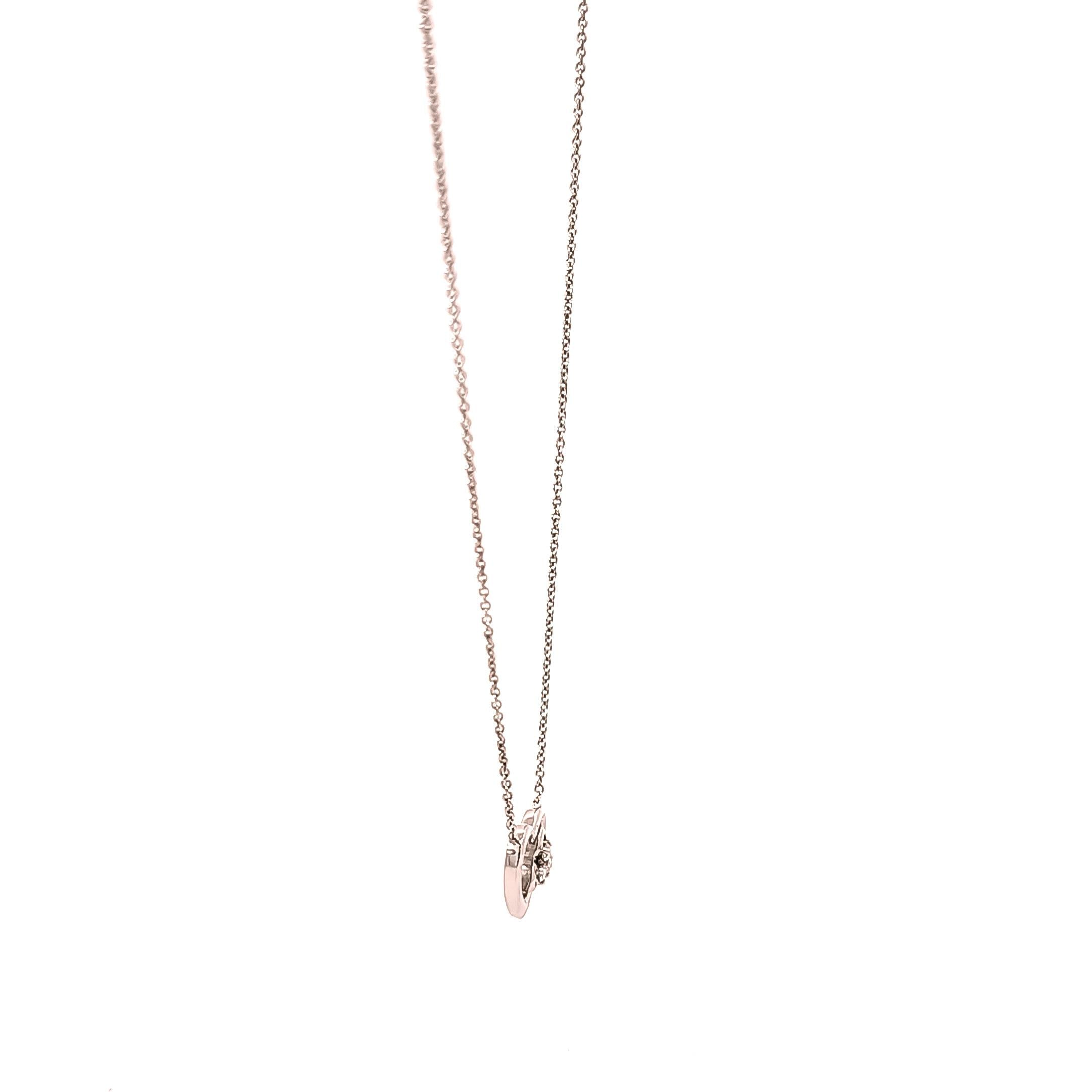 Collar en oro blanco 18kt con dije en forma de corazòn  y diamantes