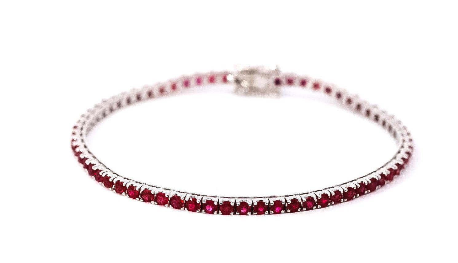 Pulsera oro blanco 18kt tipo tenis con rubís