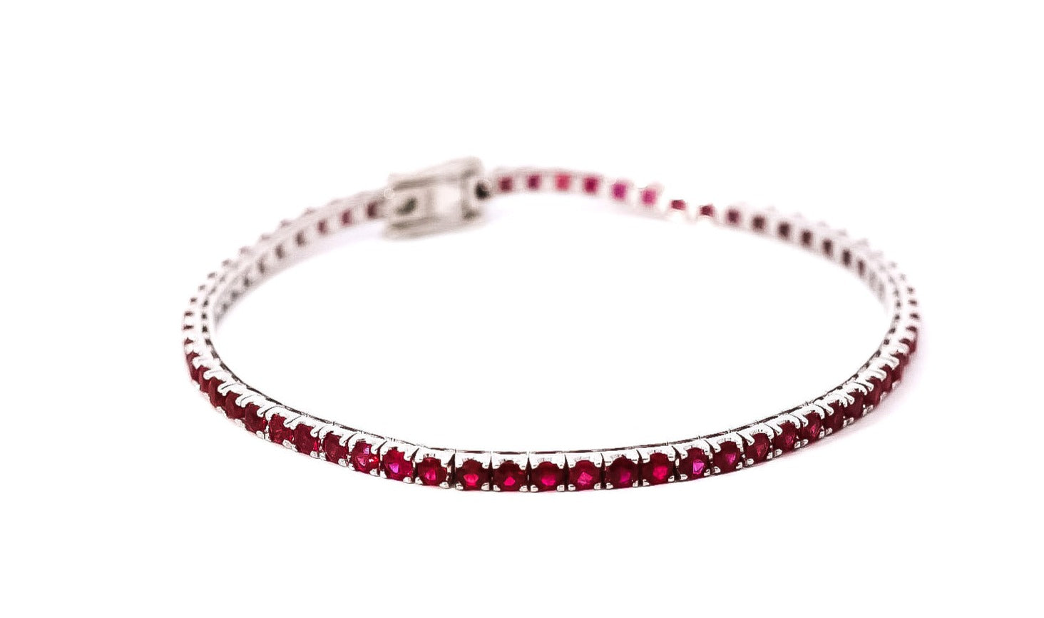 Pulsera oro blanco 18kt tipo tenis con rubís