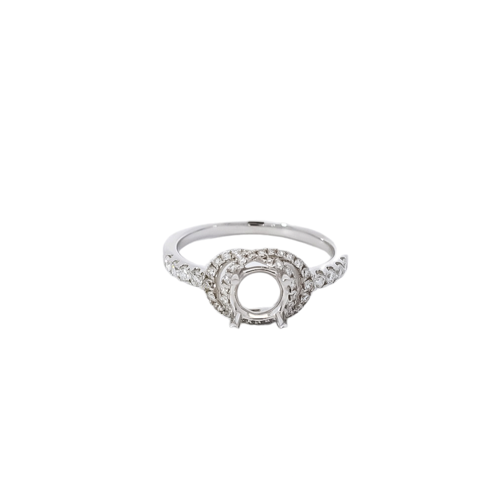 Montura  tipo fantasía de cuatro puntas  con diamantes en oro blanco 18kt