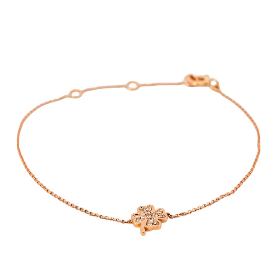 Pulsera delgada en oro rosa 18kt con dije de trébol en diamantes